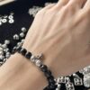 693009f512f62673a6fab8e7 Chrome Hearts 8mm Obsidian Cross Bracelet