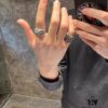 High-Version Chrome Hearts Round Grave Ring, Redefining Chrome Hearts Quality Compared to Thin and Flat Counterfeit Versions on the Market. Features Handwritten Engraving on Inner Band, Asymmetrical Cross Design with Elegant Curves and Distinct Layers. Sizes 5-11
