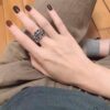 High-Version Chrome Hearts Round Grave Ring, Redefining Chrome Hearts Quality Compared to Thin and Flat Counterfeit Versions on the Market. Features Handwritten Engraving on Inner Band, Asymmetrical Cross Design with Elegant Curves and Distinct Layers. Sizes 5-11