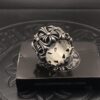 High-Version Chrome Hearts Round Grave Ring, Redefining Chrome Hearts Quality Compared to Thin and Flat Counterfeit Versions on the Market. Features Handwritten Engraving on Inner Band, Asymmetrical Cross Design with Elegant Curves and Distinct Layers. Sizes 5-11