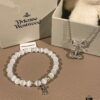 69300a9812f62673a6faba2e Chrome Hearts Cat's Eye Bracelet & Vivienne Westwood Bow Galaxy Bracelet
