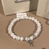 69300a9912f62673a6faba30 Chrome Hearts Cat's Eye Bracelet & Vivienne Westwood Bow Galaxy Bracelet