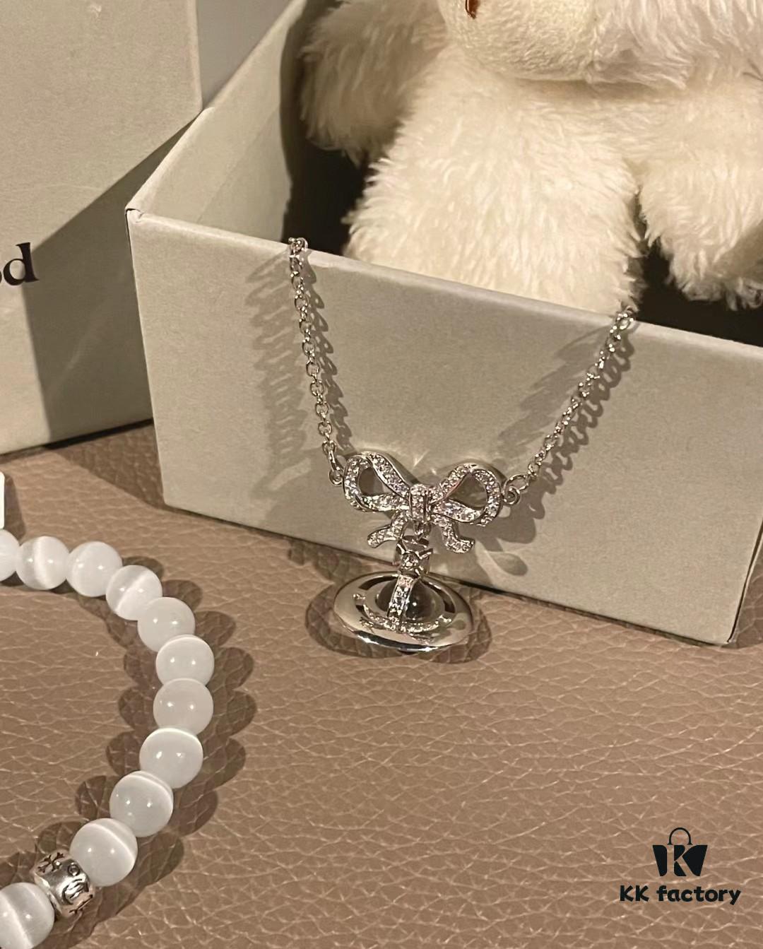 69300a9a12f62673a6faba34 Chrome Hearts Cat's Eye Bracelet & Vivienne Westwood Bow Galaxy Bracelet