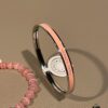 69300c2612f62673a6fabd15 Cute Chrome Heart Cat's Eye Bracelet and Hermes Enamel Bangle