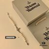 69300ce812f62673a6fabe78 Vivienne Westwood Pearl Planet Bracelet