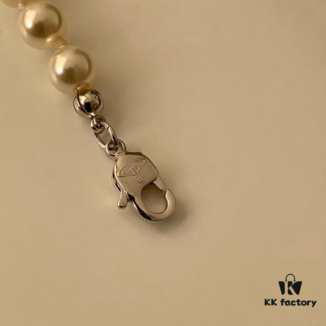 69300cea12f62673a6fabe7d Vivienne Westwood Pearl Planet Bracelet