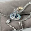 69300d3112f62673a6fabf03 Vivienne Westwood Saturn Necklace in Silver and Blue with Gradient Small Diamonds
