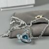 69300d3312f62673a6fabf06 Vivienne Westwood Saturn Necklace in Silver and Blue with Gradient Small Diamonds