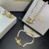 69300d3312f62673a6fabf08 Vivienne Westwood Saturn Pearl Necklace - Bracelet - Earrings