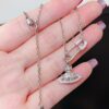 69300d9112f62673a6fabfbc Vivian New Arrival Pin Saturn Necklace, Perfect for Showcasing the Neckline