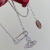 69300d9e12f62673a6fabfce Vivian New Arrival Pin Saturn Necklace, Perfect for Showcasing the Neckline