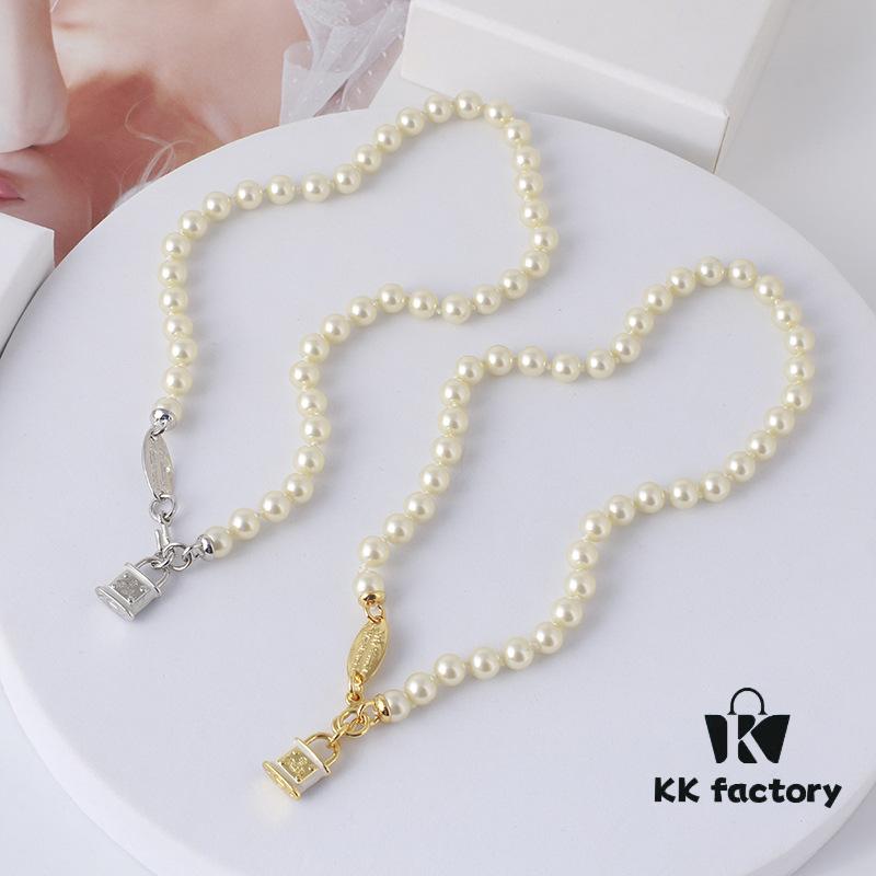 69300da112f62673a6fabfd5 Wholesale European and American Fashion Jewelry Saturn Pearl and Enamel 3D Small Lock Necklace for Women, Drop Shipping Available