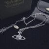 69300db012f62673a6fabfe5 Vivienne Westwood Saturn Planet Set Crown Earrings and Necklace, Celebrity Style, Custom Diamond-Inlaid Saturn Design, Fashion Trendsetter