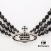 69300edb12f62673a6fac191 Vivienne Westwood Black Crystal Triple Saturn Necklace, Slimming Design