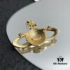 West Grandma Saturn Brooch
