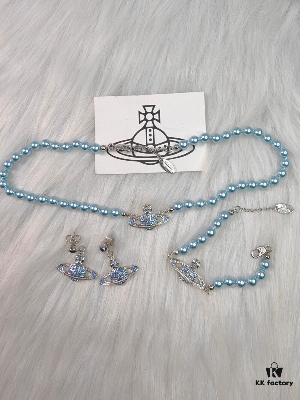 69300f9f12f62673a6fac2c5 West Queen Blue Saturn Pearl Necklace, Bracelet, and Earring Set