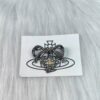 69300feb12f62673a6fac349 Vivienne Westwood Titanium Black Heart Bow Brooch