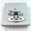 West Queen White Enamel Saturn Brooch