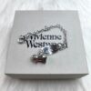 6930105c12f62673a6fac401 Vivienne Westwood Pig Bracelet in Gold and White Gold Color, In Stock