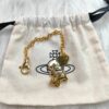 6930105d12f62673a6fac402 Vivienne Westwood Pig Bracelet in Gold and White Gold Color, In Stock