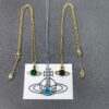 West Queen Single Diamond Blue, Brown, Green Necklace in Gold and White Gold with Blue Diamond