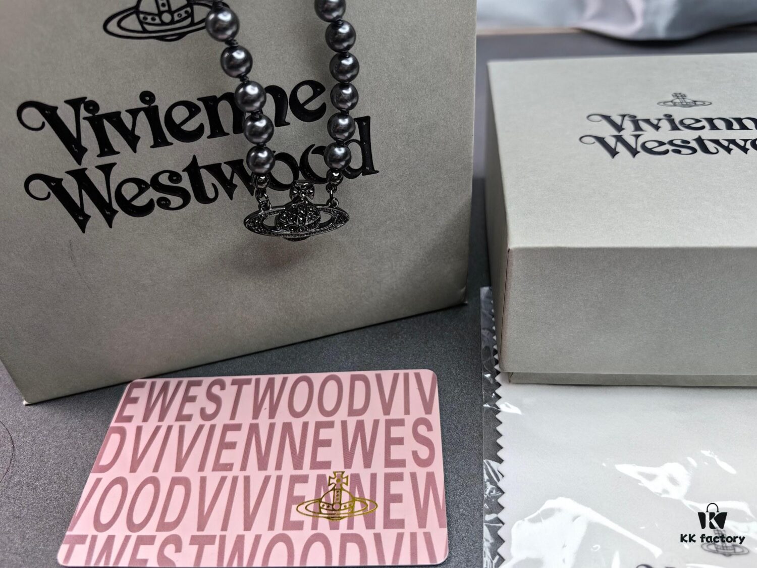 6930107d12f62673a6fac42e Vivienne Westwood Black Gun Color Saturn Pearl Necklace