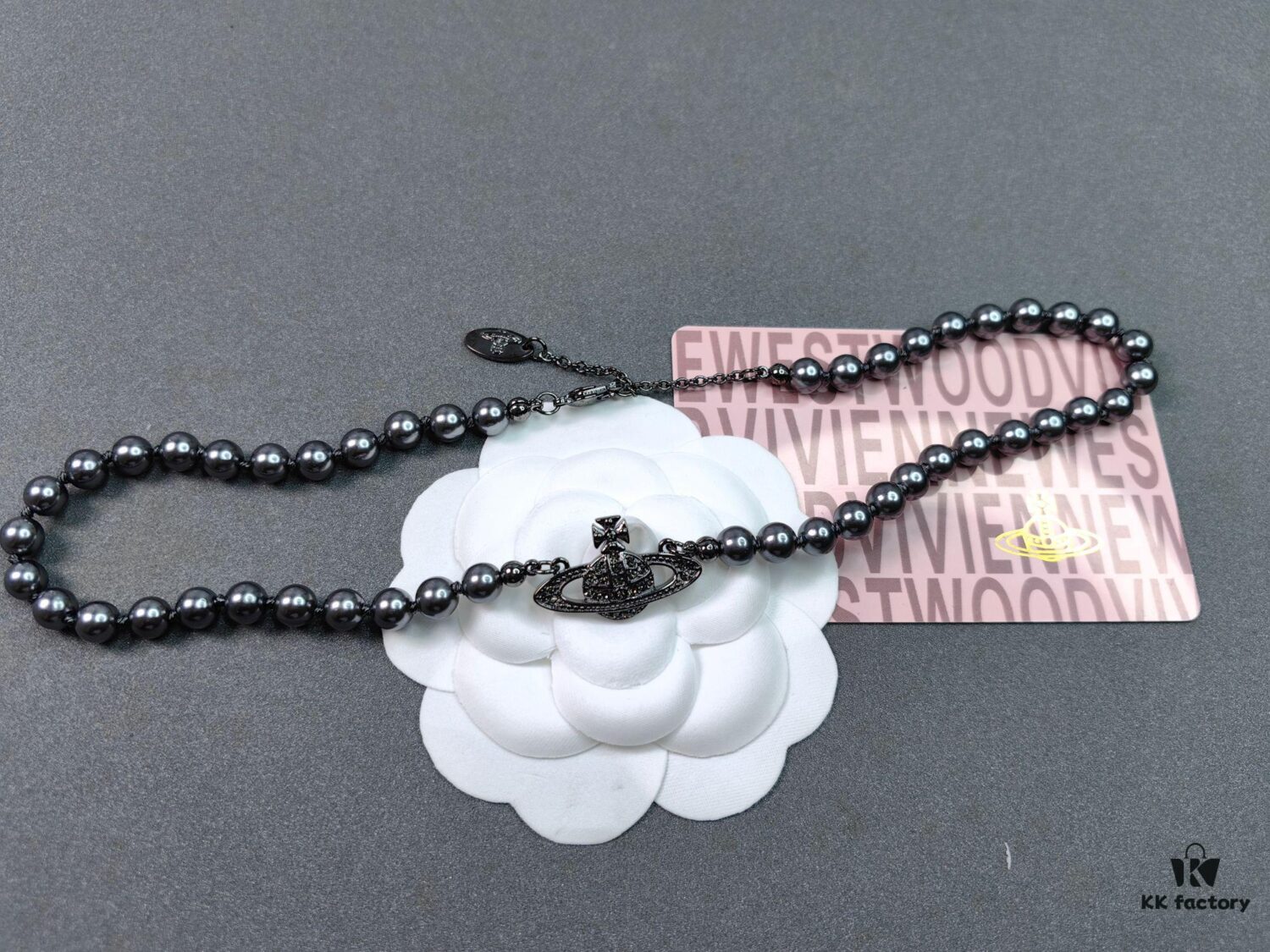 6930107f12f62673a6fac431 Vivienne Westwood Black Gun Color Saturn Pearl Necklace