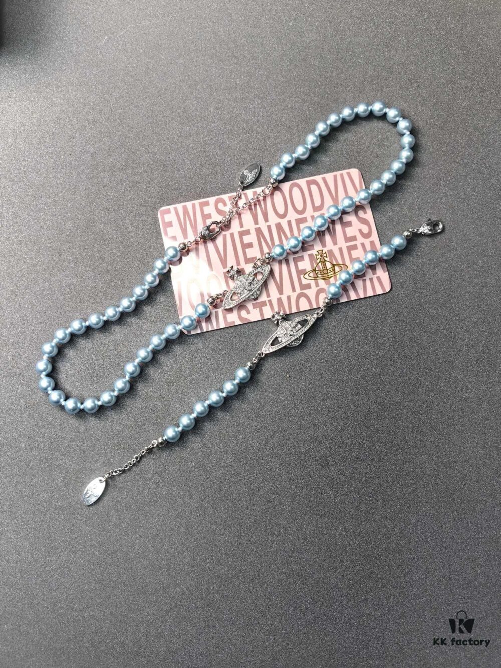 6930109812f62673a6fac448 West Queen Light Blue Pearl Saturn Necklace and Bracelet
