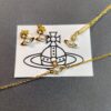 693010c312f62673a6fac47a West Queen Half-Pearl Necklace, Bracelet, and Stud Earrings in White Gold and Yellow Gold Two-Tone
