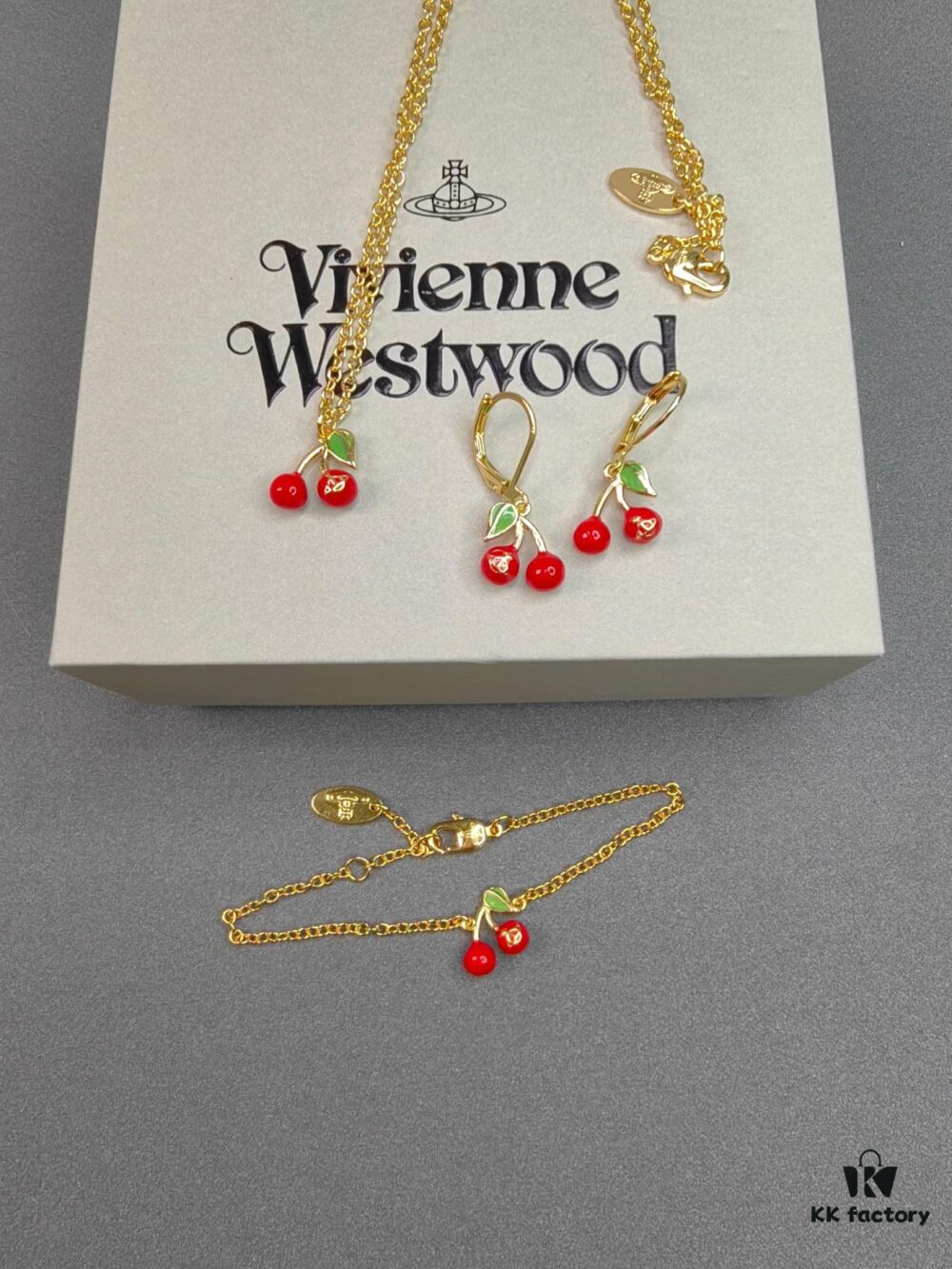 693010c912f62673a6fac481 West Queen Cherry Necklace, Bracelet, Earrings in Gold Color