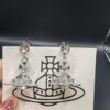 693010ed12f62673a6fac4b5 Vivienne Westwood Transparent Glass Orb Earrings in White Gold, Yellow Gold, and Rose Gold
