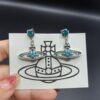 West Dame Saturn Earrings