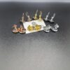 693010f512f62673a6fac4c4 Vivienne Westwood Transparent Glass Orb Earrings in White Gold, Yellow Gold, and Rose Gold