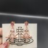 693010fb12f62673a6fac4d0 Vivienne Westwood Transparent Glass Orb Earrings in White Gold, Yellow Gold, and Rose Gold