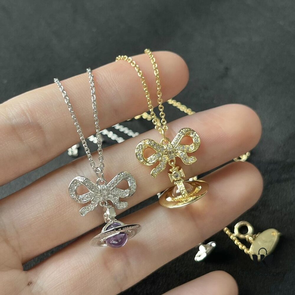 6930112812f62673a6fac50b Westminster Saturn Octavie Bow Orb Planet Necklace