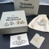 West Queen Half-Round Pearl Mini Saturn Stud Earrings