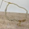 6930118a12f62673a6fac585 Saturn | Vivienne Westwood Jewelry - Brooch Style Pearl Necklace and Bracelet