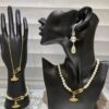 6930118e12f62673a6fac587 Saturn | Vivienne Westwood Jewelry - Brooch Style Pearl Necklace and Bracelet