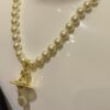 6930119a12f62673a6fac593 Vivienne Westwood Golden Saturn ORB Pearl Necklace