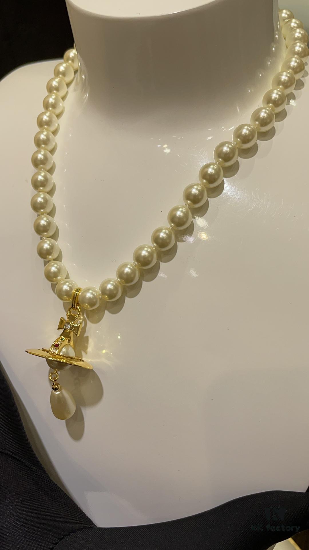 6930119a12f62673a6fac593 Vivienne Westwood Golden Saturn ORB Pearl Necklace