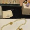 6930119b12f62673a6fac595 Vivienne Westwood Golden Saturn ORB Pearl Necklace