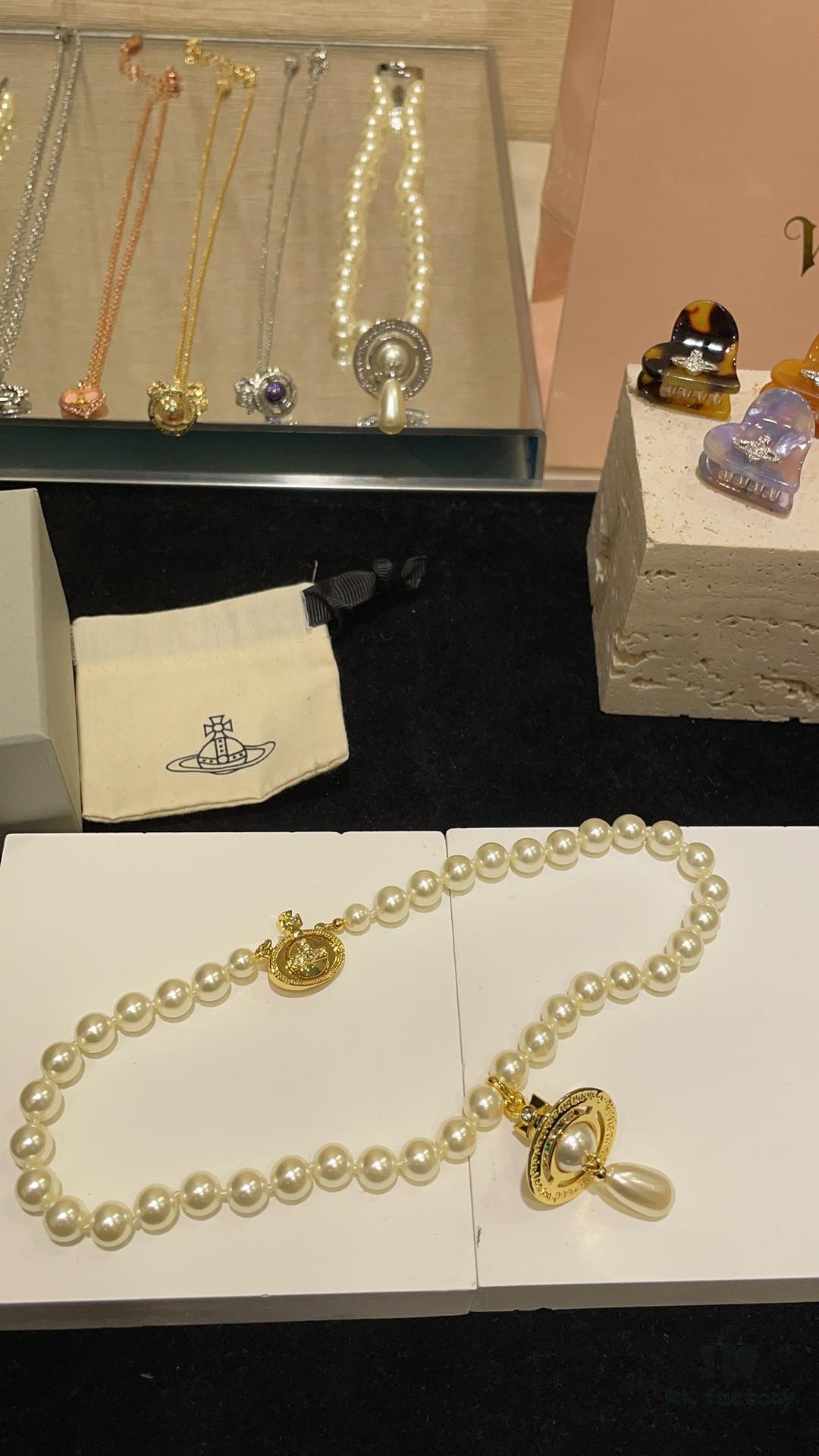 6930119b12f62673a6fac595 Vivienne Westwood Golden Saturn ORB Pearl Necklace