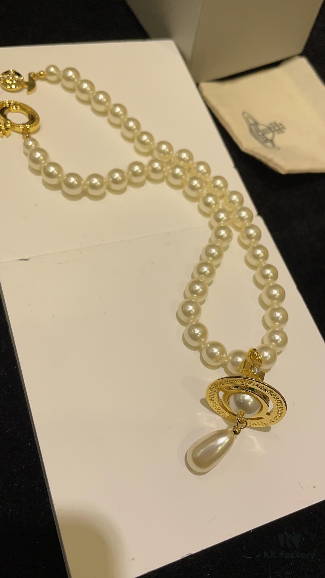 6930119c12f62673a6fac596 Vivienne Westwood Golden Saturn ORB Pearl Necklace