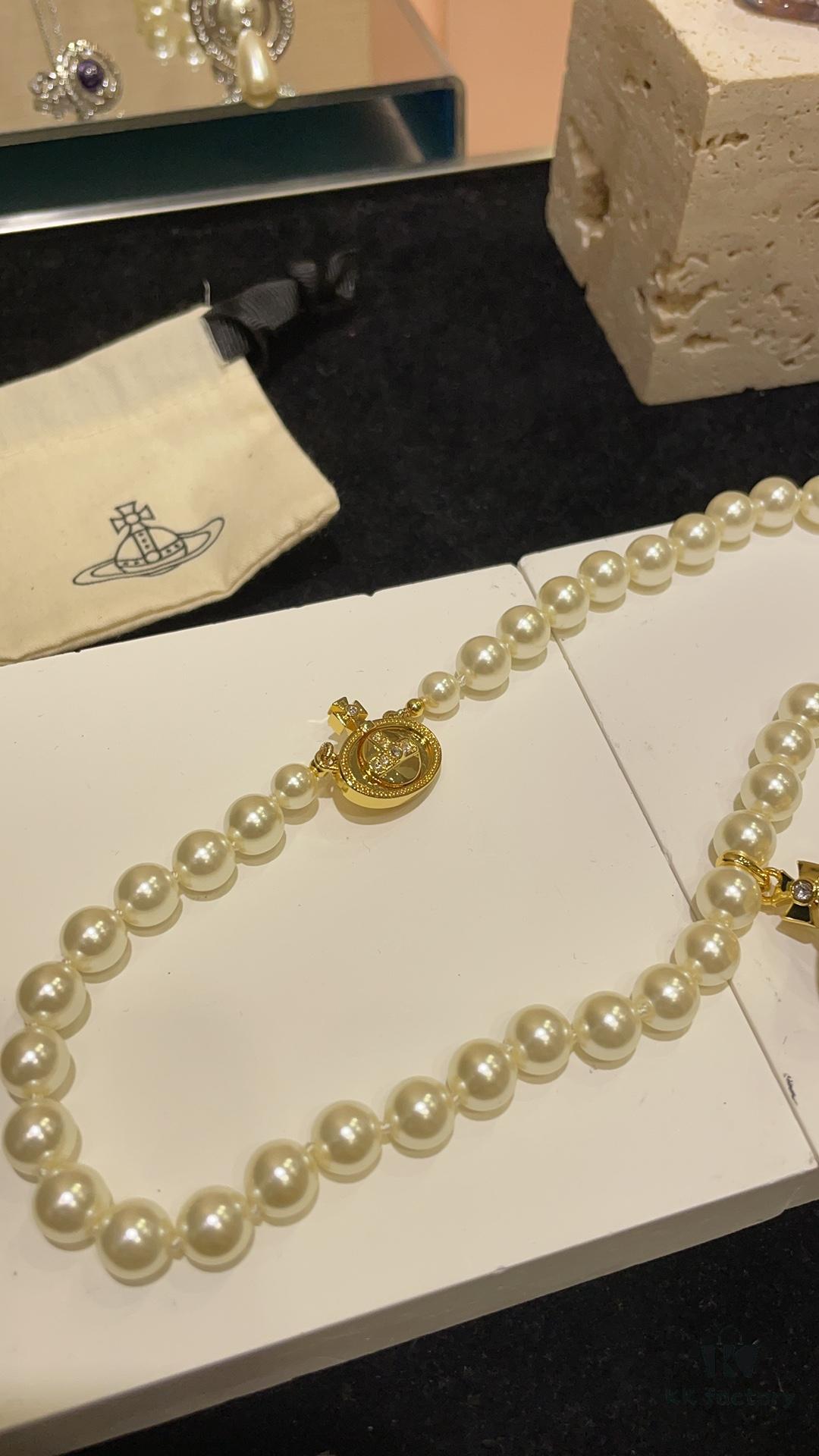 6930119f12f62673a6fac597 Vivienne Westwood Golden Saturn ORB Pearl Necklace