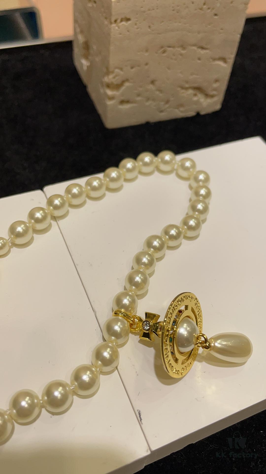 6930119f12f62673a6fac598 Vivienne Westwood Golden Saturn ORB Pearl Necklace