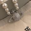 693011b812f62673a6fac5c2 Vivienne Westwood Saturn Pearl Necklace - Medium Size, Rhinestone-Embellished Crown Pendant with Elegant Shine