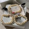 693011c212f62673a6fac5d1 Vivienne Westwood Enamel Pearl Bracelet – Magnetic Clasp, Reversible Design, Six New 2023 Colors Available