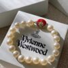 693011c312f62673a6fac5d2 Vivienne Westwood Enamel Pearl Bracelet – Magnetic Clasp, Reversible Design, Six New 2023 Colors Available
