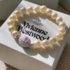 693011c612f62673a6fac5d3 Vivienne Westwood Enamel Pearl Bracelet – Magnetic Clasp, Reversible Design, Six New 2023 Colors Available