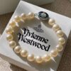 693011c612f62673a6fac5d4 Vivienne Westwood Enamel Pearl Bracelet – Magnetic Clasp, Reversible Design, Six New 2023 Colors Available